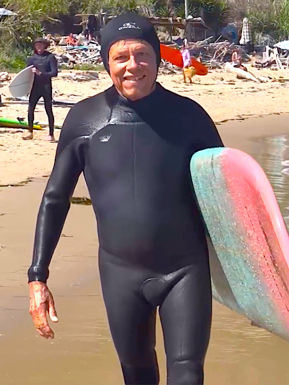 Kevin Ruddick with surfboard