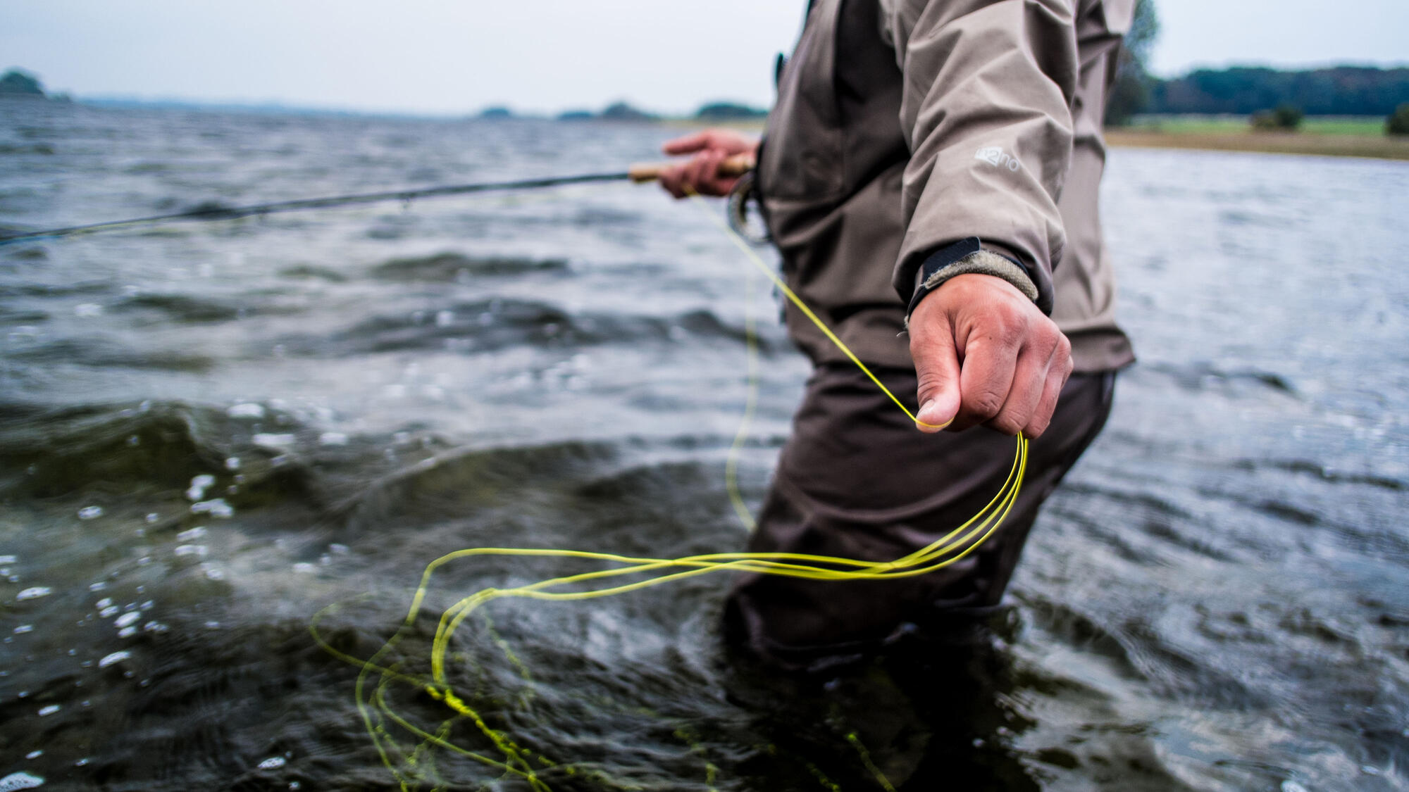 Man in the water, using rope